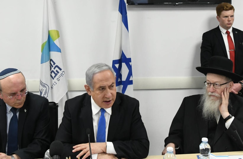 Prime Minister Benjamin Netanyahu and Health Minister Ya'akov Litzman discuss the dangers of coronavirus on February 23 (photo credit: GPO)