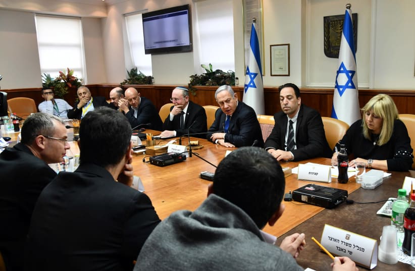 Prime Minister Benjamin Netanyahu chairs a meeting on Israel's preparations for the implications of the coronavirus, Prime Minister's Office in Jerusalem, Febraury 25, 2020 (photo credit: HAIM ZACH/GPO)
