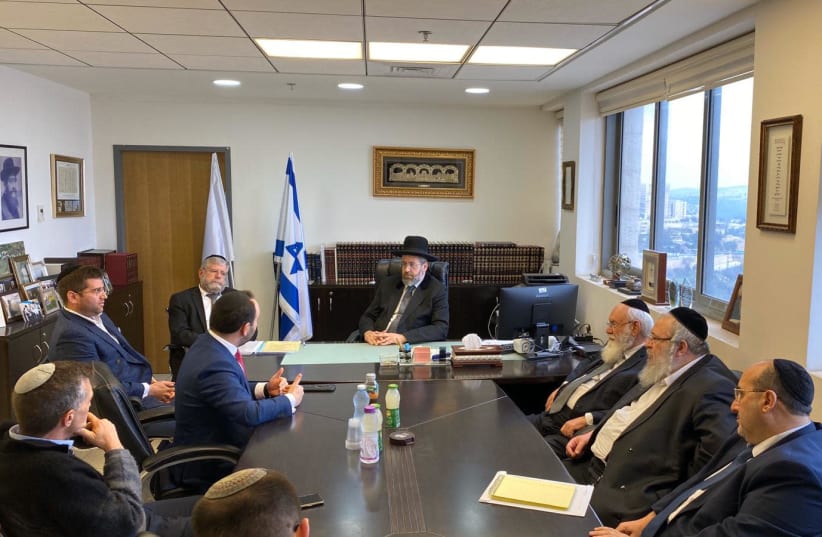 Belgian MP Michael Freilich meets with Chief Rabbi David Lau and other Chief Rabbinate officials on Monday to discuss efforts to head off challenges to circumcision in Belgium (photo credit: CHIEF RABBINATE)