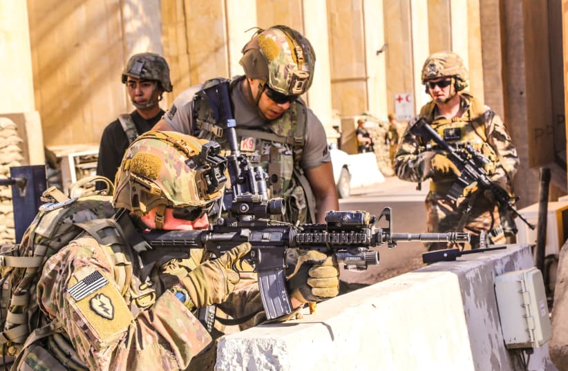 U.S. Army soldiers from 1st Brigade, 25th Infantry Division, Task Force-Iraq, man a defensive position at Forward Operating Base Union III in Baghdad, Iraq, December 31, 2019 (photo credit: U.S. ARMY/STAFF SGT. DESMOND CASSELL/TASK FORCE-IRAQ PUBLIC AFFAIRS/HANDOUT VIA REUTERS)