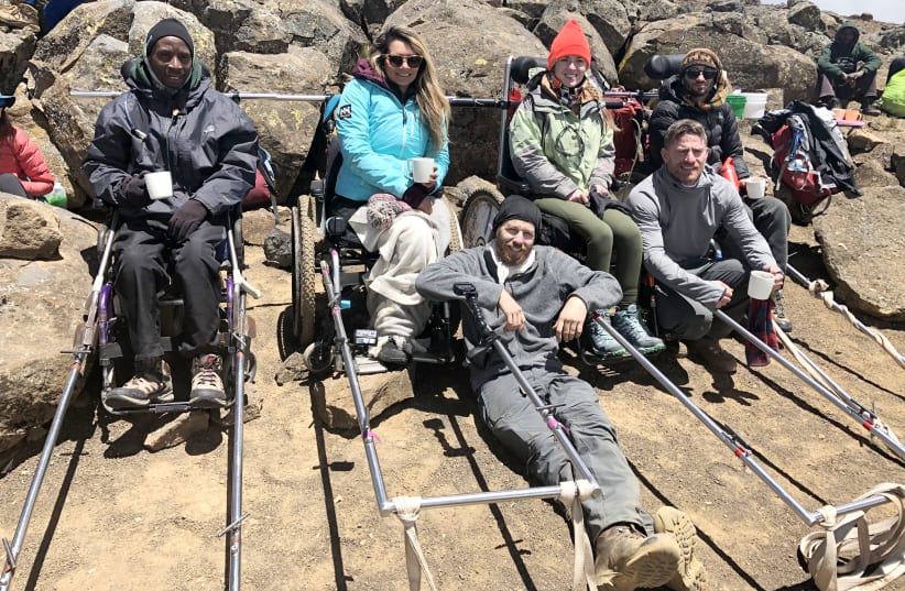 TO THE summit: (front from left) Paratrek CEO Omer Zur and co-worker Rowee Benbenishty; cliimbers with disabilities (back row, left to right) in Paratreks: Arnold John, Marcela Maranon, Starla Hiliard-Barnes and Arnon Amit (photo credit: Courtesy)