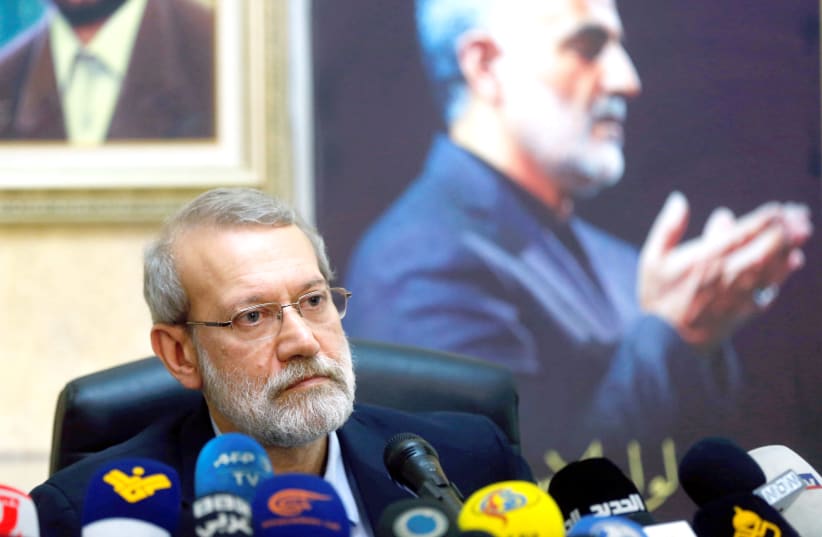 IRANIAN PARLIAMENT speaker Ali Larijani attends a news conference at the Iranian Embassy in Beirut’s southern suburbs, as a picture of late Iranian Quds Force top commander Qasem Soleimani is seen in the background, on February 17.  (photo credit: REUTERS)