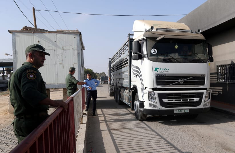 A truck carrying cattle arrives at Kerem Shalom crossing after it was reopened by Israel, in Rafah in the southern Gaza Strip October 21, 2018 (photo credit: REUTERS/IBRAHEEM ABU MUSTAFA)