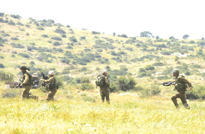 IDF troops during a training exercise – ‘In a situation where Israel is coping with multiple fronts, we still need to decide... what is the priority. This is a difficult problem.’ (photo credit: MARC ISRAEL SELLEM/THE JERUSALEM POST)