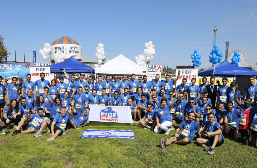 The FIDF IMPACT! Scholarship team of 270 runners at the 2020 Tel Aviv Marathon (photo credit: GUY YECHIELY)