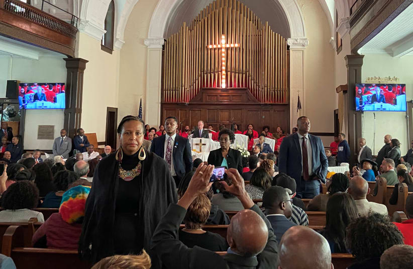 Attendees stand and turn their backs on Democratic U.S. presidential candidate Michael Bloomberg as he talks about his plans to help the U.S. black community during a commemoration ceremony for the 55th anniversary of the "Bloody Sunday" march in the Brown AME Church in Selma, Alabama, U.S., March 1 (photo credit: REUTERS/JOSEPH AX)