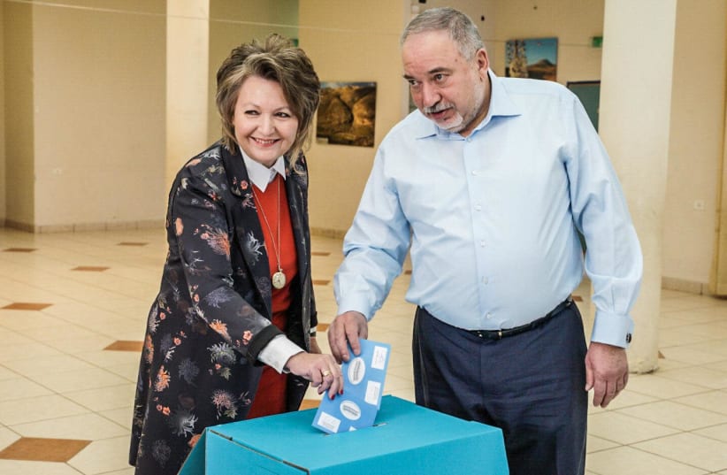 Yisrael Beytenu chairman Avigdor Liberman and his wife Ella cast their vote in Nokdim (photo credit: Courtesy)