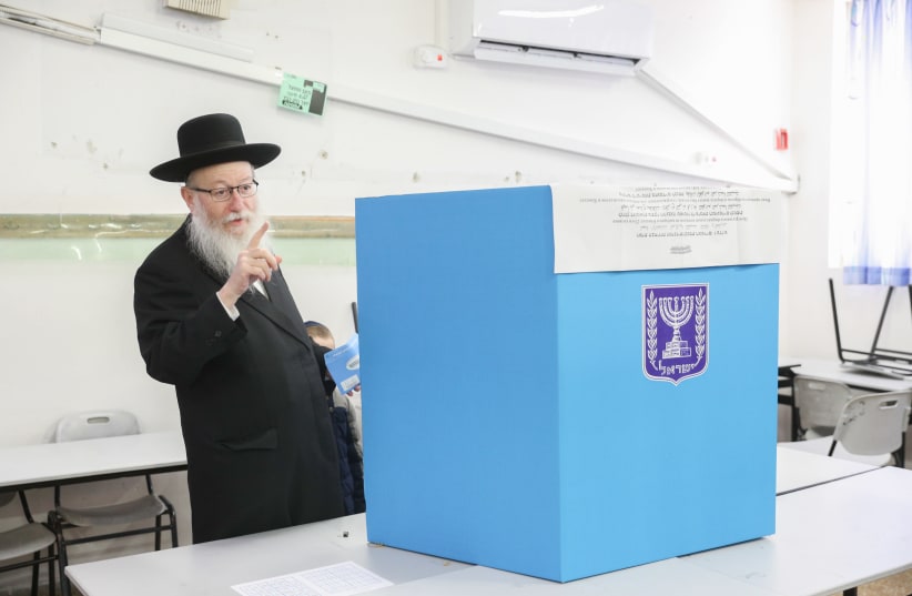 Israel Health Minister's deputy, Yaakov Ltzman, casts his ballot at a voting station in Jerusalem, during the Knesset Elections, on March 02, 2020. (photo credit: YONATAN SINDEL/FLASH90)