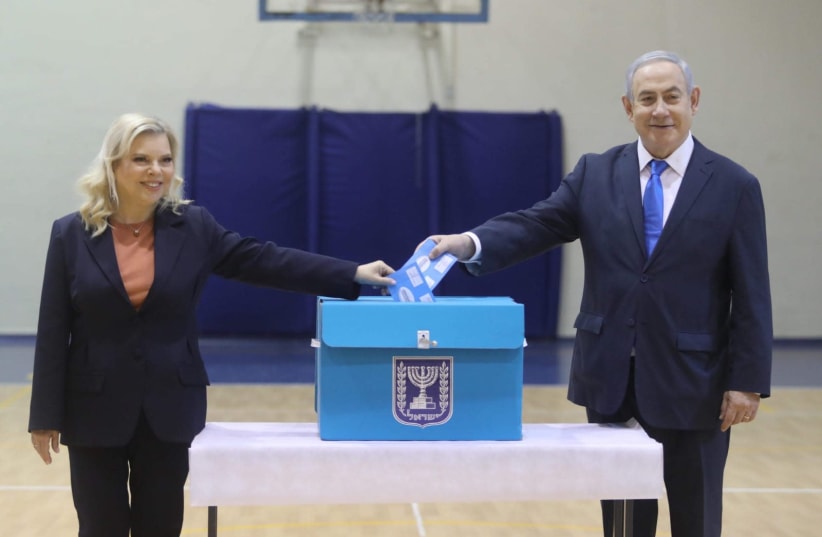 Prime Minister Benjamin Netanyahu and his wife Sara voting for the 23rd Knesset on Monday (photo credit: MARC ISRAEL SELLEM/THE JERUSALEM POST)