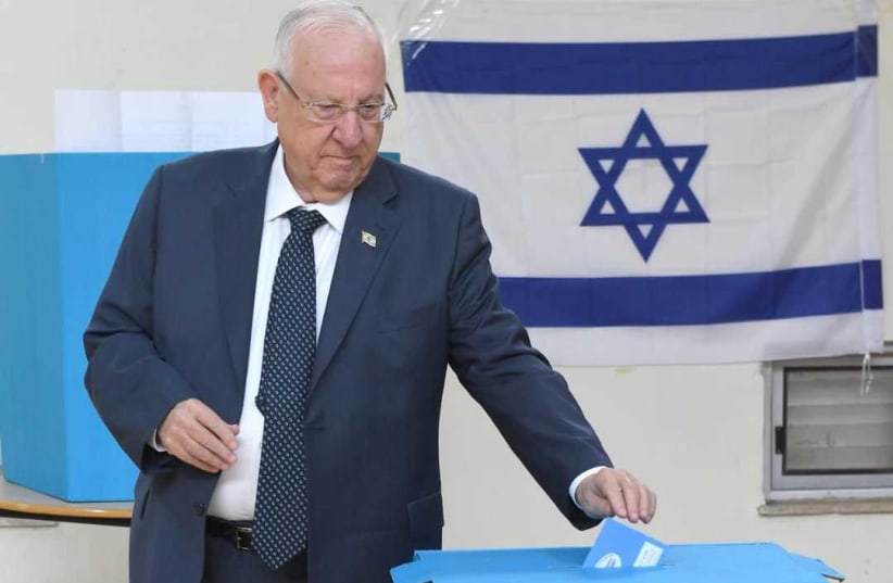 President Reuven Rivlin voting for the 23rd Knesset on Monday (photo credit: MARK NEYMAN/GPO)