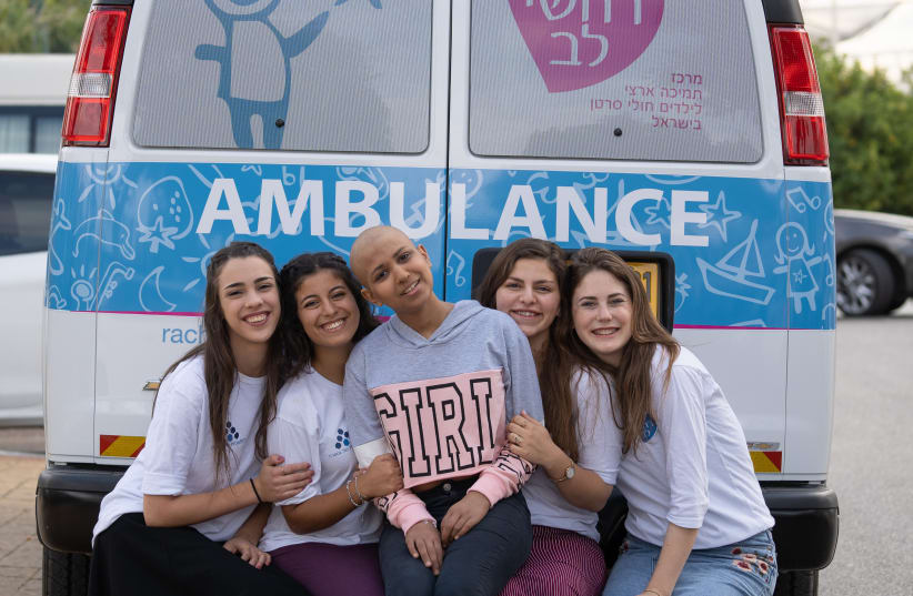 EIGHTEEN-YEAR-OLD  Stav with her national service volunteers, traveling to the hospital for treatment in the Rachashei Lev Dream ambulance.  (photo credit: DANIEL COHEN)