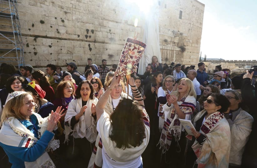 WOMEN OF THE Wall dance with a Torah scroll at the Western Wall in Jerusalem. (photo credit: MARC ISRAEL SELLEM/THE JERUSALEM POST)