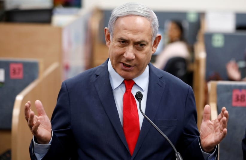 Prime Minister Benjamin Netanyahu gestures as he delivers a statement (photo credit: REUTERS/AMIR COHEN)