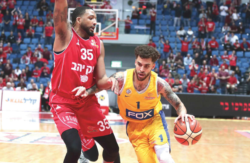 TASHAWN THOMAS (left) and Hapoel Jerusalem advanced to the Champions League quarterfinals on Wednesday night, while Scottie Wilbekin (right) and Maccabi Tel Aviv had their Euroleague campaign suspended due to coronavirus. (photo credit: DANNY MARON)