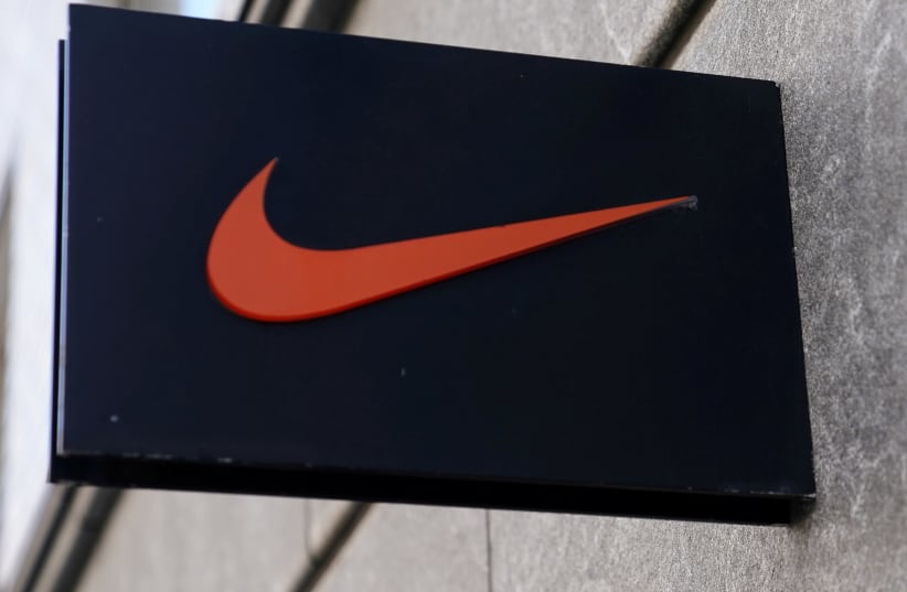 The Nike swoosh logo is pictured on a store in New York City, New York, U.S., September 4, 2018 (photo credit: REUTERS/CARLO ALLEGRI)