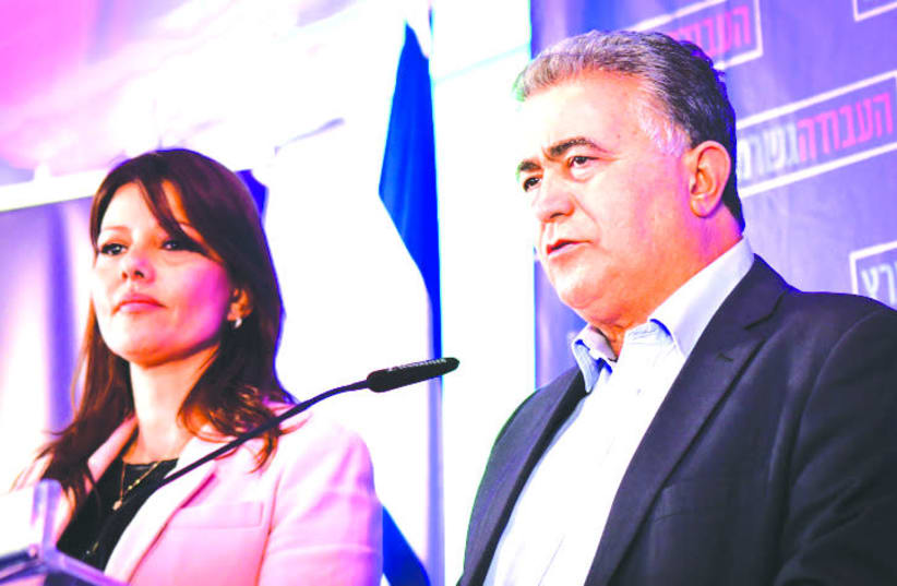 ORLY LEVY-ABECASSIS and Amir Peretz at party headquarters on election night in Tel Aviv on March 2. (photo credit: AVSHALOM SASSONI/FLASH90)