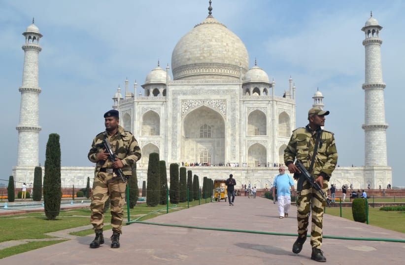 Central Industrial Security Force (CISF) personnel patrol at the historic Taj Mahal premises, where U.S. President Donald Trump and first lady Melania Trump are expected to visit, in Agra, India, February 20, 2020 (photo credit: REUTERS/STRINGER)