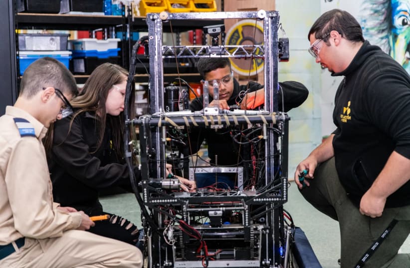 HARD AT work on a robotics project: World ORT students in Dimona. (photo credit: WORLD ORT)