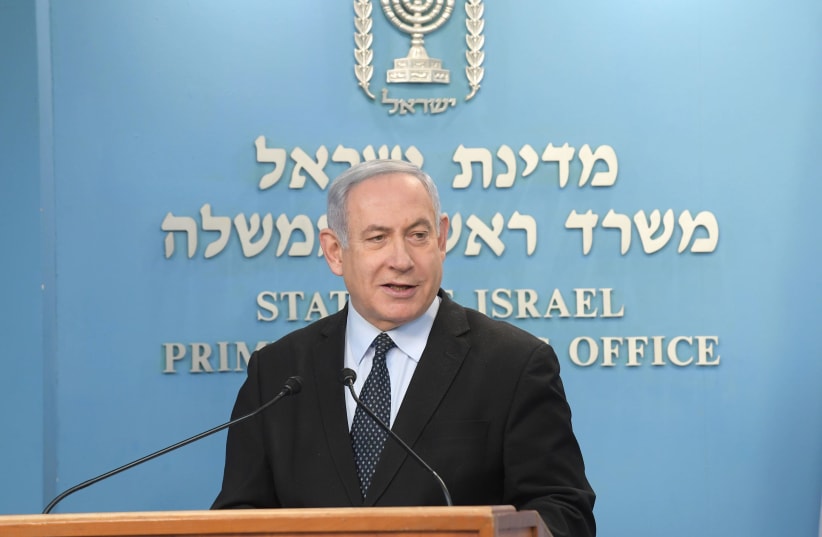 Prime Minister Benjamin Netanyahu addresses the nation on the coronavirus outbreak, March 19, 2020 (photo credit: AMOS BEN-GERSHOM/GPO)