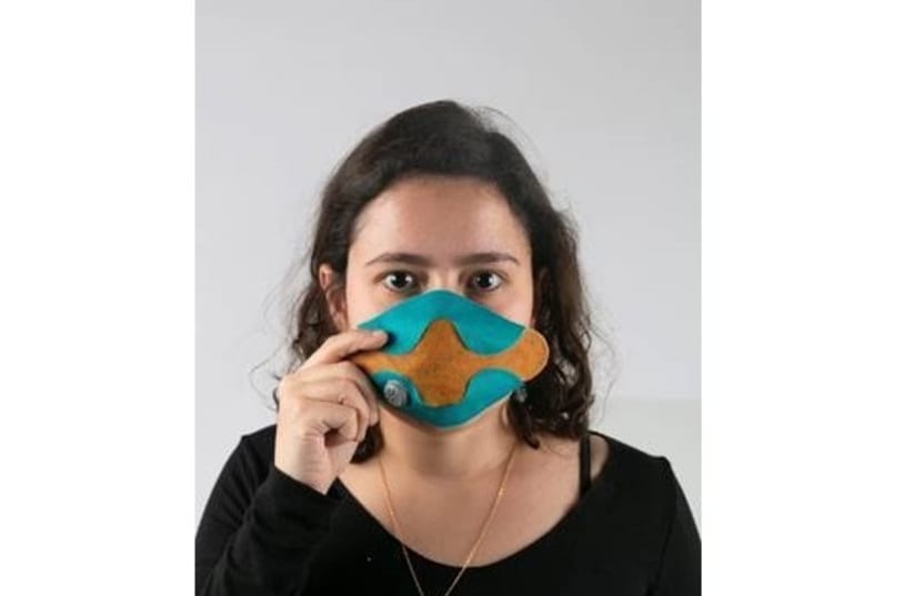 Yeal Mordechay, an industrial design student at Bezalel Academy, wears the protective mask that she designed.  (photo credit: Courtesy)