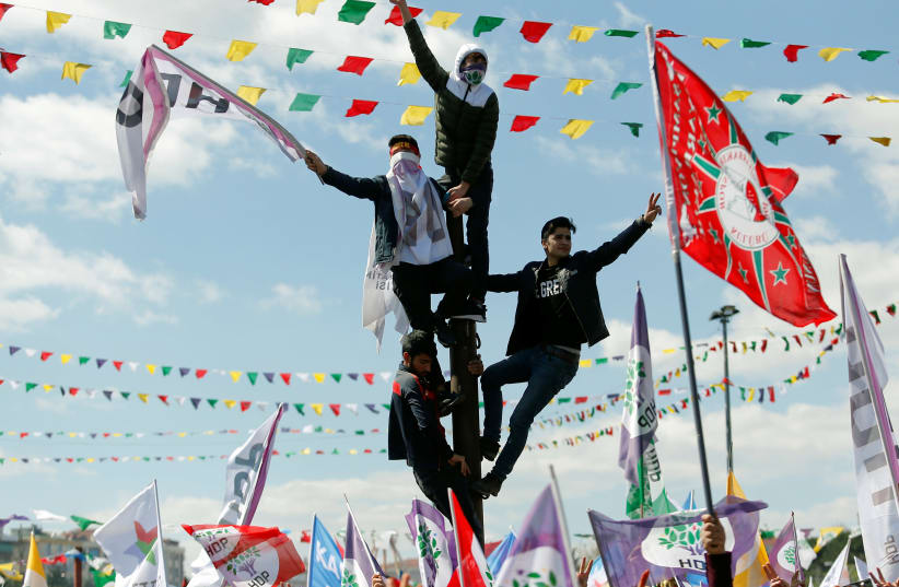 People gather to celebrate Newroz, which marks the arrival of spring and the new year, in Istanbul (photo credit: REUTERS)