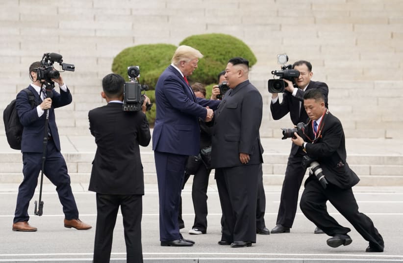 US President Donald Trump meets with North Korean leader Kim Jong Un. (photo credit: REUTERS/KEVIN LAMARQUE)
