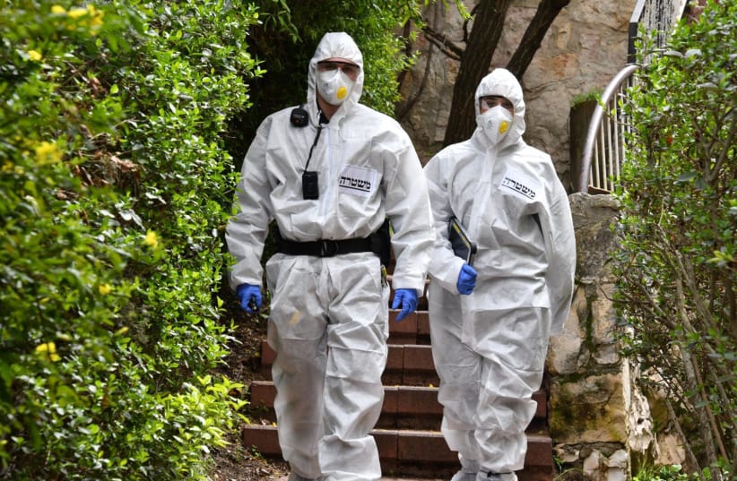 Police officers in coronavirus protective suits (photo credit: POLICE SPOKESPERSON'S UNIT)