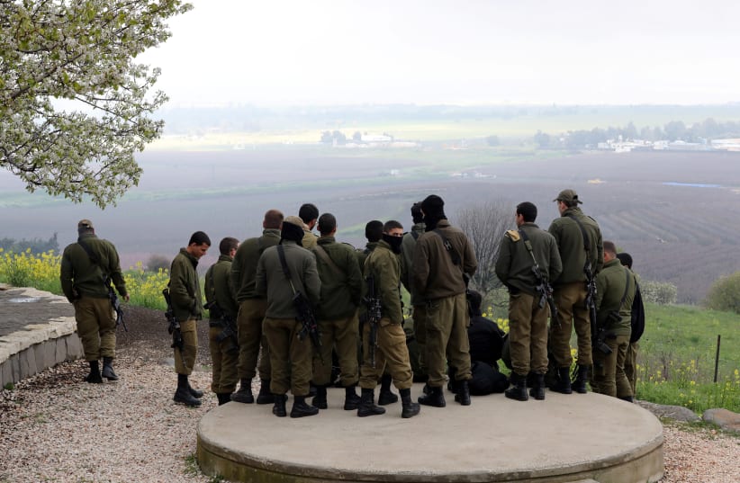 ISRAELI SOLDIERS stand in a circle in the Golan. (photo credit: REUTERS)