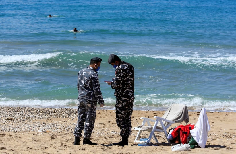 LEBANESE POLICE write people a ticket for using the beach. (photo credit: REUTERS)