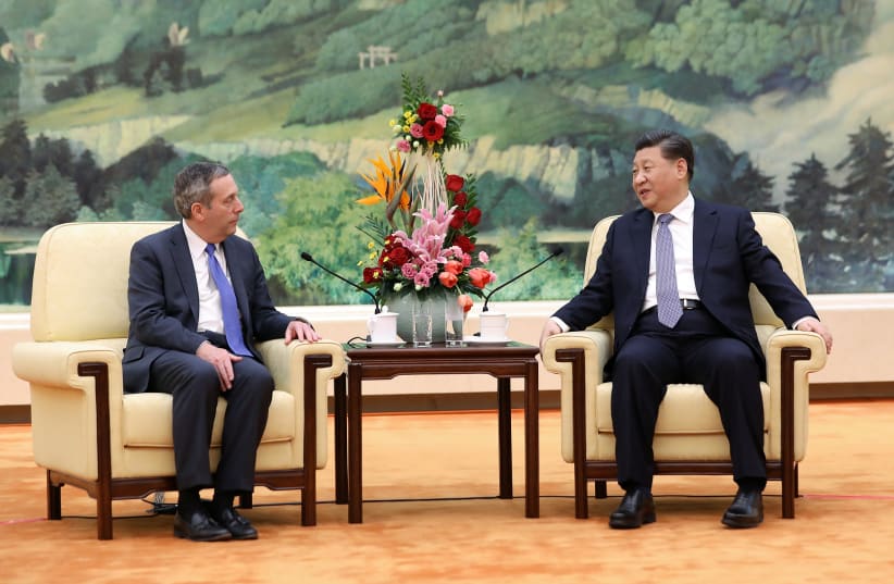 Chinese President Xi Jinping meets Harvard University President Lawrence Bacow at the Great Hall of the People in Beijing, China March 20, 2019. (photo credit: REUTERS)