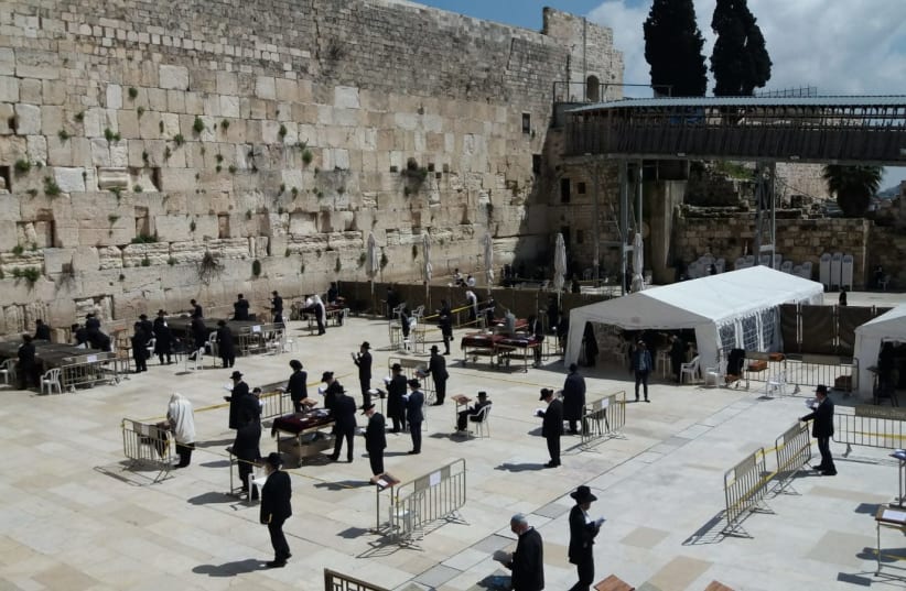 Worshipers at the Western Wall adhere to Health Ministry regulations by maintaining social distance.  (photo credit: THE WESTERN WALL HERITAGE FOUNDATION)