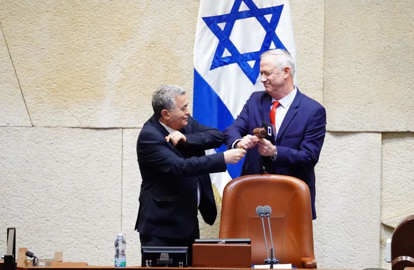 Amir Peretz gives newly-elected Knesset Speaker Benny Gantz the gavel on March 26, 2020 (photo credit: KNESSET SPOKESWOMAN - ADINA WALDMAN)