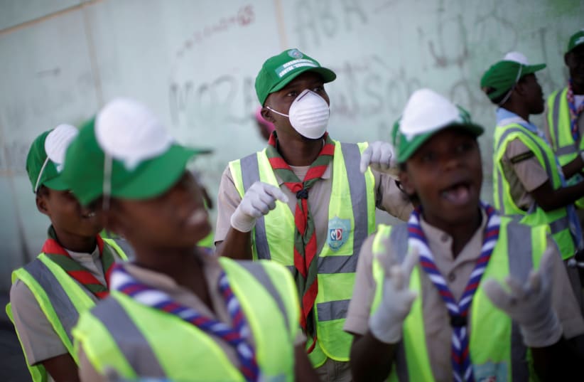 Haitian Scouts take part in COVID-19 prevention campaign in Port-au-Prince (photo credit: REUTERS)