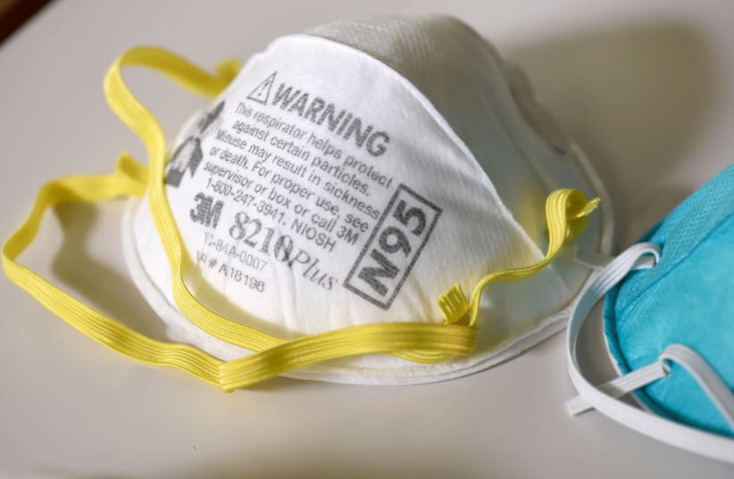 Various N95 respiration masks at a laboratory of 3M, that has been contracted by the U.S. government to produce extra marks in response to the country's novel coronavirus outbreak, in Maplewood, Minnesota, U.S. March 4, 2020. Picture taken March 4, 2020 (photo credit: REUTERS/NICHOLAS PFOSI)