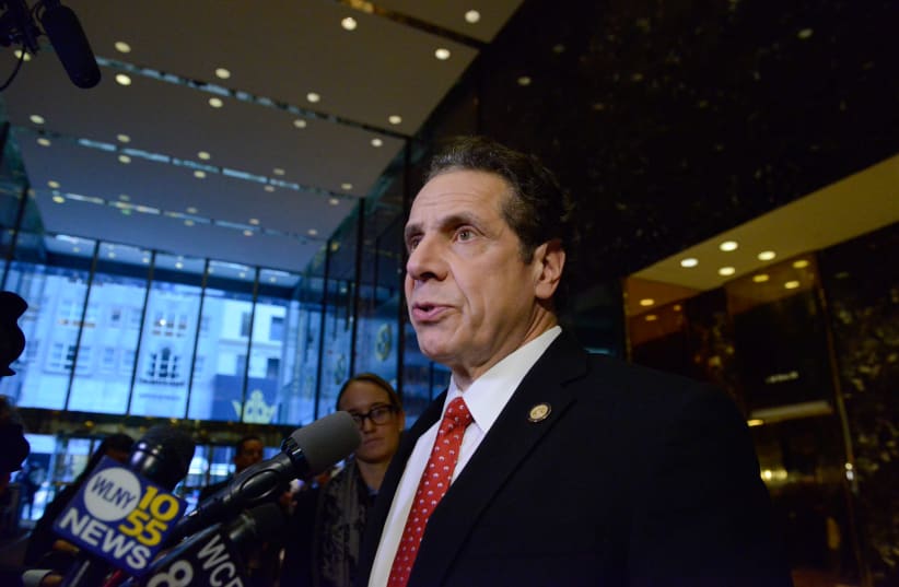 Andrew Cuomo, Governor of New York, speaks to members of the press at Trump Tower in New York City, U.S. January 18, 2017 (photo credit: REUTERS/STEPHANIE KEITH)