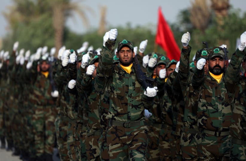 Members of the paramilitary Popular Mobilisation Forces (PMF) take part in their graduation ceremony at a military camp in Kerbala (photo credit: REUTERS/ABDULLAH DHIAA AL-DEEN)