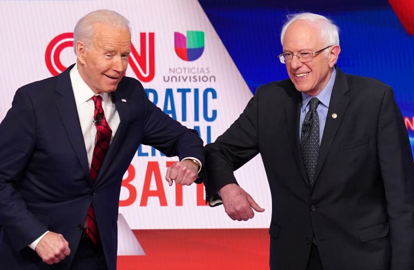 Democratic U.S. presidential candidates Senator Bernie Sanders and former Vice President Joe Biden at the 11th Democratic candidates debate of the 2020 U.S. presidential campaign in Washington, March 15, 2020 (photo credit: KEVIN LAMARQUE/REUTERS)