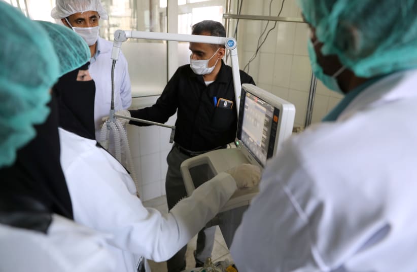Nurses receive training on using ventilators, recently provided by the World Health Organization at the intensive care ward of a hospital allocated for novel coronavirus patients in preparation for any possible spread of the coronavirus disease (COVID-19), in Sanaa, Yemen April 8, 2020. Picture take (photo credit: KHALED ABDULLAH/ REUTERS)