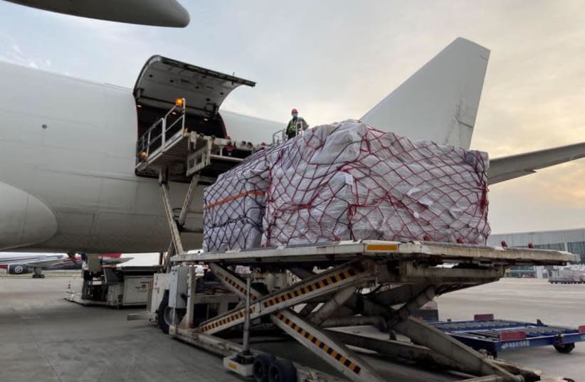 A Cal Cargo jet being loaded in China with medical gear on the way to Israel to fight coronavirus  (photo credit: DEFENSE MINISTRY)