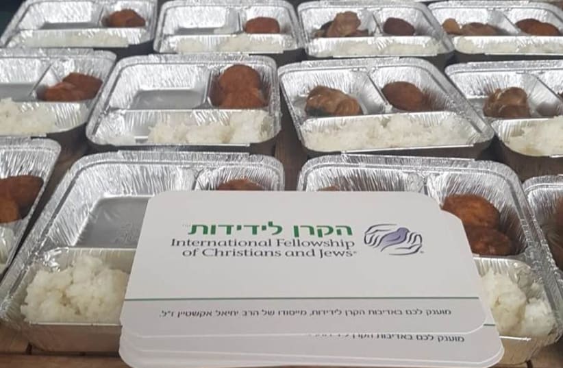 An emergency grant by The International Fellowship of Christians and Jews enables soup kitchen meal delivery to help those who can no longer come to them for aid (photo credit: IFCJ)