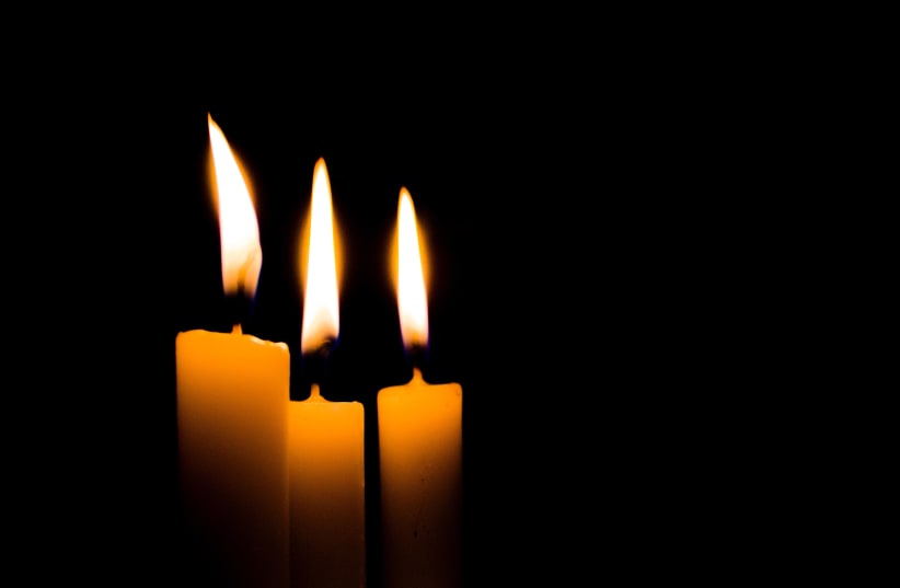 Candles burn (photo credit: CALEB HERNANDEZ BELMONTE-/UNSPLASH)