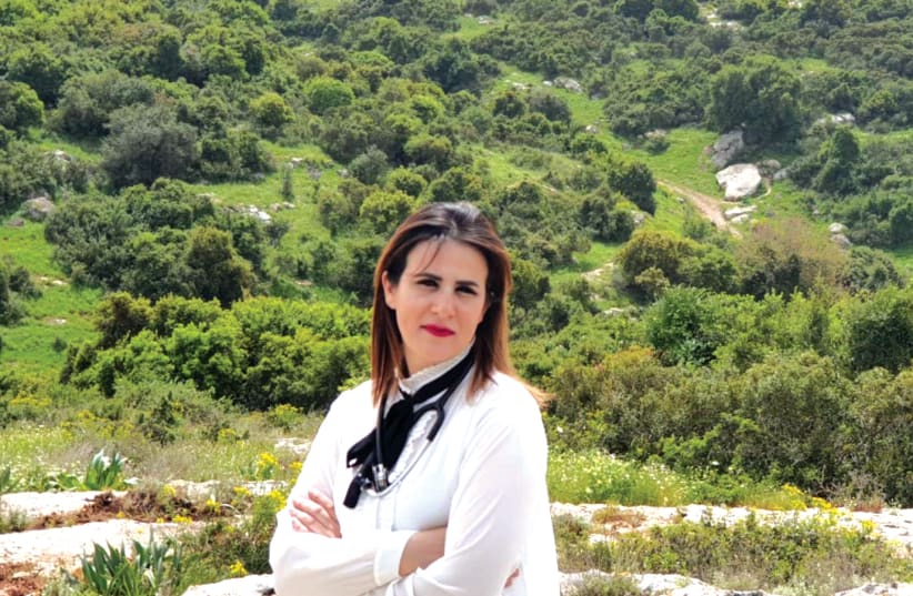 Mai Mazareeb against the backdrop of Beit Zarzir (photo credit: Courtesy)