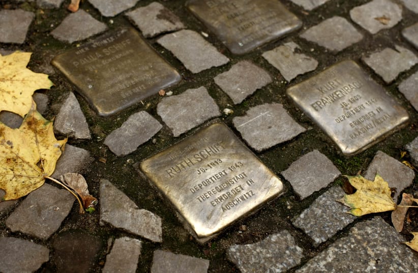 A MAIN character’s journey takes him to Theresienstadt and Auschwitz. Memorial plaques commemorating German Jews murdered in those two concentration camps dot the Berlin pavement in 2008 (photo credit: REUTERS/FABRIZIO BENSCH)