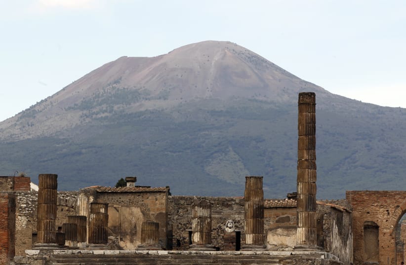 A partial view of the ancient archaeological site of Pompeii is pictured in front of Mount Vesuvius April 17, 2014 (photo credit: REUTERS/CIRO DE LUCA)