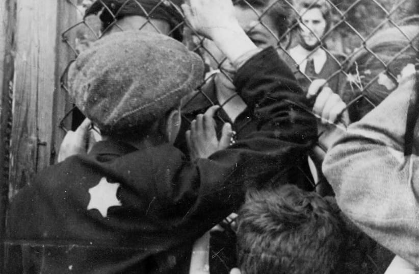 Children say goodbye to their friends at the fence of the Lodz ghetto. (photo credit: YAD VASHEM PHOTO ARCHIVES)