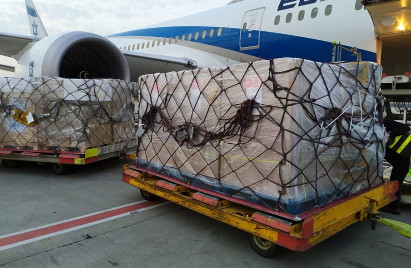 Tens of thousands of coronavirus tests and processing equipment arrived from China after negotiations with Beijing Genomics Institute (photo credit: EL AL)