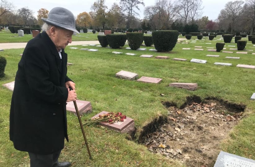 Holocaust survivor Michael Okunieff visiting his wife's grave in Chicago before making aliyah in November 2019 (photo credit: DAVID PERSIKO)
