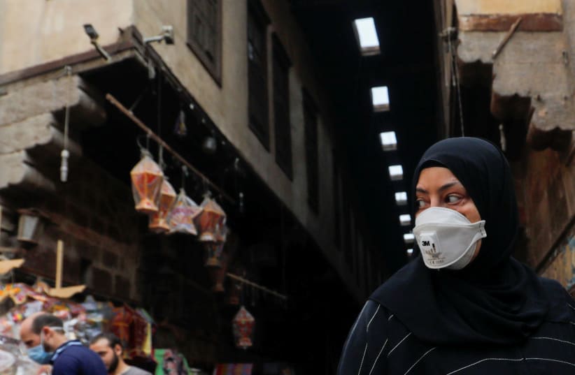 The spread of the coronavirus disease (COVID-19), ahead of the Muslim holy month of Ramadan in Cairo, Egypt (photo credit: AMR ABDALLAH DALSH / REUTERS)