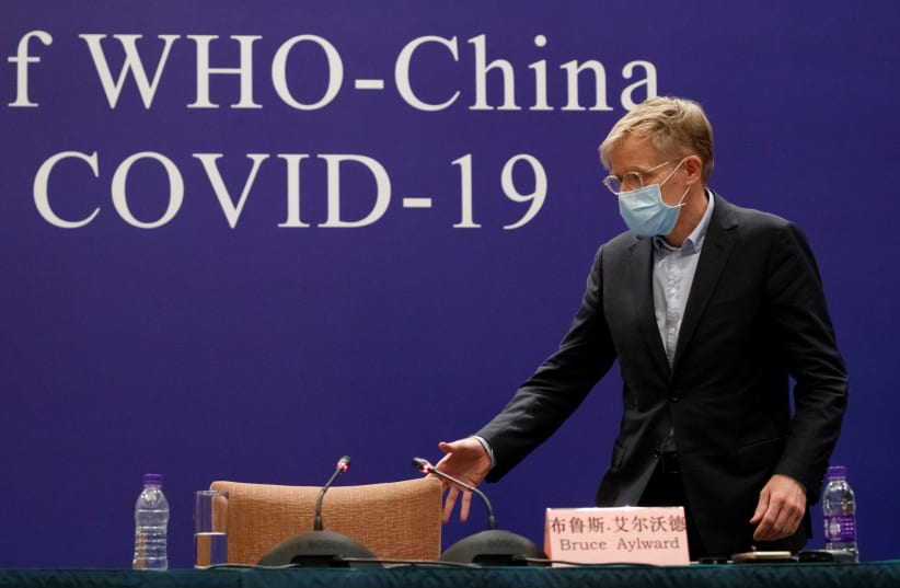 Bruce Aylward of the World Health Organisation (WHO) attends a news conference of the WHO-China Joint Mission on Covid-19 about its investigation of the coronavirus outbreak in Beijing, China, February 24, 2020. (photo credit: REUTERS/THOMAS PETER)