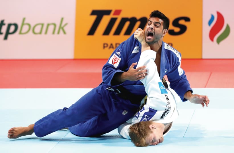 ISRAEL JUDOKA Sagi Muki (top) – one of the blue-and-white’s top medal contender at the Olympics – has been training by himself over the past month, but can’t wait to return to the mat in some capacity as soon as possible. (photo credit: REUTERS)